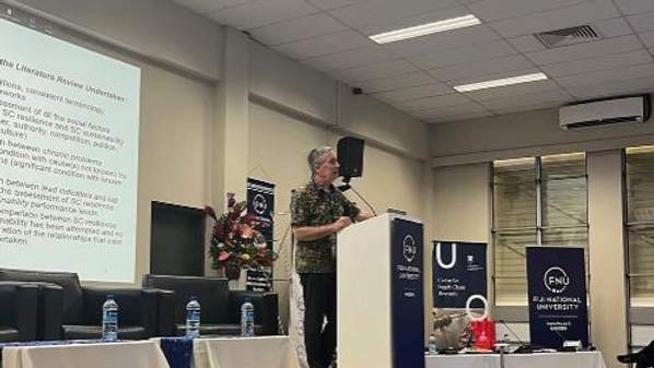 UOW Honorary Research Fellow, Dr Peter Robertson presenting