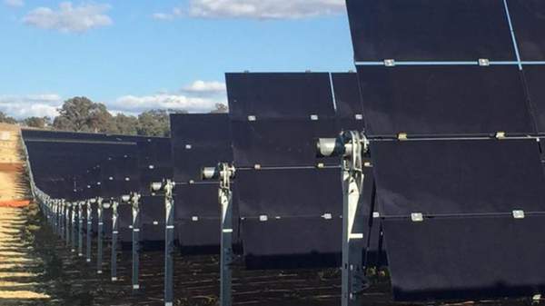 Solar panel farm with rows and rows of panels