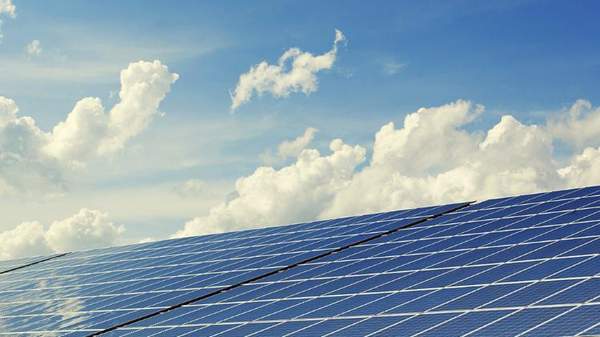 Solar panels in front of a blue sky