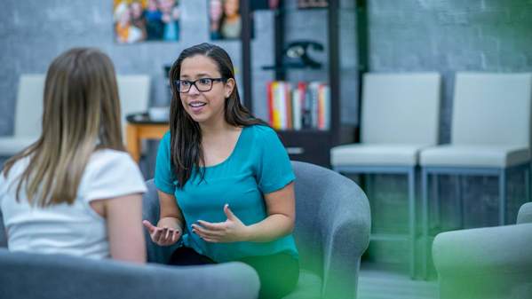 Image of two students talking