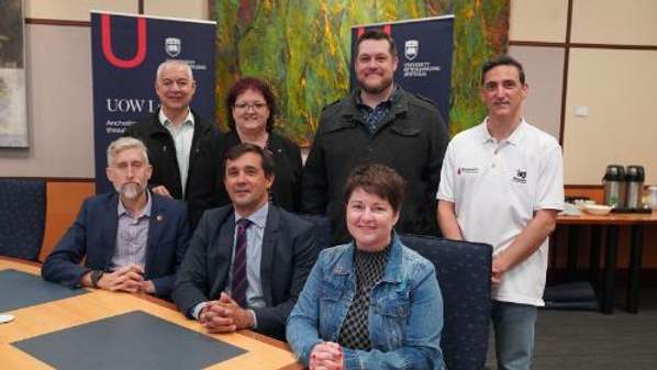 Front row: Ed Birt (The Disability Trust), UOW Acting Chief Operating Officer Matthew Wright, Kelly Andrews (Healthy Cities Illawarra). Back row: Chris Christodoulou (Greenacres), Tania Brown (UOW Local), Daniel Chin (Raise the Bar) and Salv Carmusciano (Illawarra Academy of Sport).