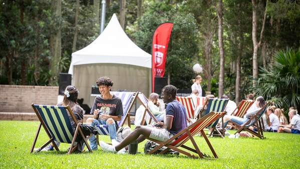 Students on the duck pond lawn