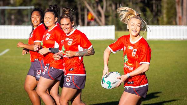 Players from the St George Illawarra Dragons women's team training on one of UOW's ovals.