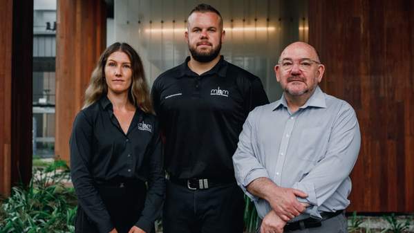 Dr Alisha McGregor, Dan Hunt, and Professor Peter Caputi stand in front of a building on UOW's Wollongong Campus.  Photo: Paul Jones