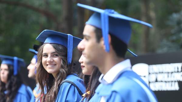 Graduates female looking to camera