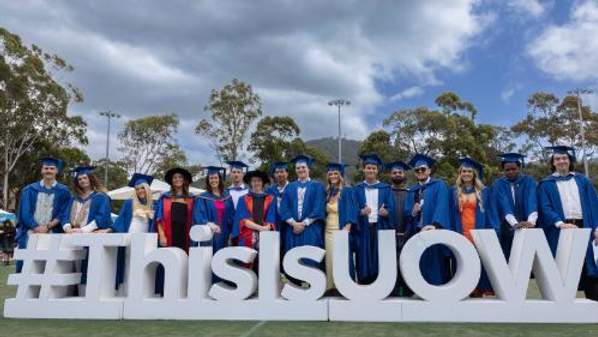 UOW graduates in gowns and mortarboards at the November 2023 graduation ceremonies. Photo by Mark Newsham