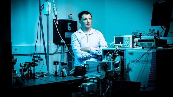 Dr Shane Ellis standing cross-armed behind equipment in the Mass Spectrometry Imaging Laboratory at UOW Wollongong. Photo: Paul Jones