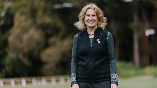 Professor Sharon Robinson smiles as she stands on campus in ý. Photo: Michael Gray