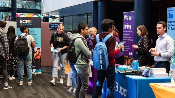 Students talk with exhibitors at the UOW STEM and Health Careers Expo.