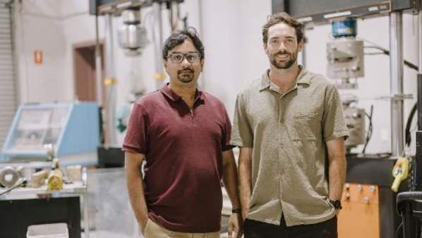 Professor Faisal Hai and Michael Staplevan standing in front of lab equipment in UOW’s Strategic Water Infrastructure Lab. Photo: Michael Gray