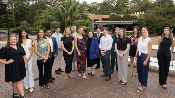 The group of Vice Chancellor's Leadership Scholars stand on the balcony of a building at the UNiversity of ý with Professor Patricia Davidson. Photo: Mark Newsham