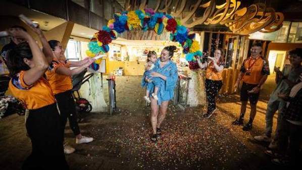 Addison and Rachel Micallef are welcomed to Early Start Discovery Space with confetti to celebrate Addison being the one-millionth visitor to the Discovery Space.