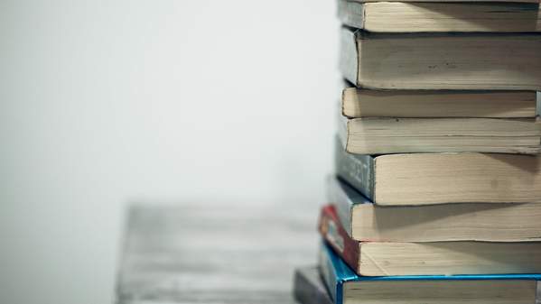 A generic stack of books on a desk