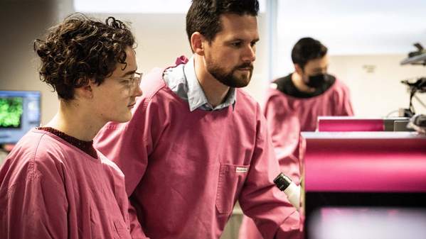 Lauren Ashcroft and Dr Cameron Ferris in a lab