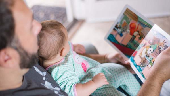 Parent and a child reading a book