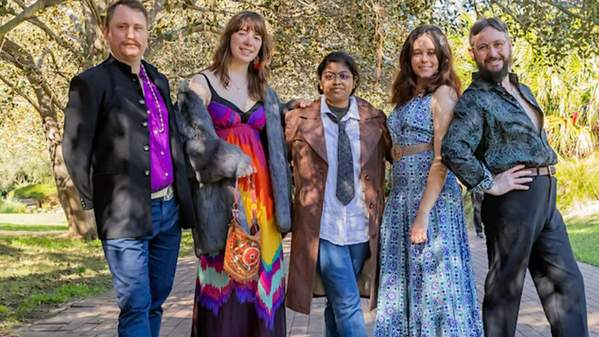 UOW Op Shop volunteers dressed colourfully
