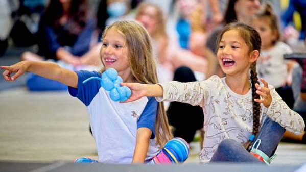 Girls watching circus performance