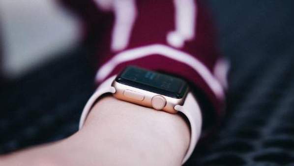 Person wearing a gold  Apple watch. Photo by Maxwell Ridgeway, Unsplash</a>