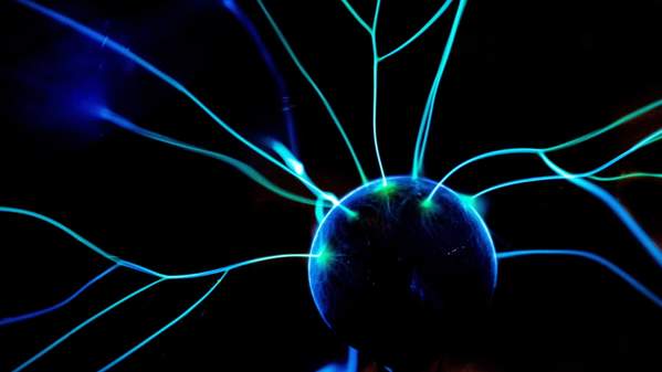 A blue and green ball with tentacles coming out of it on a black background. Photo: Unsplash