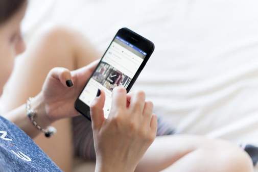 Woman holding mobile phone