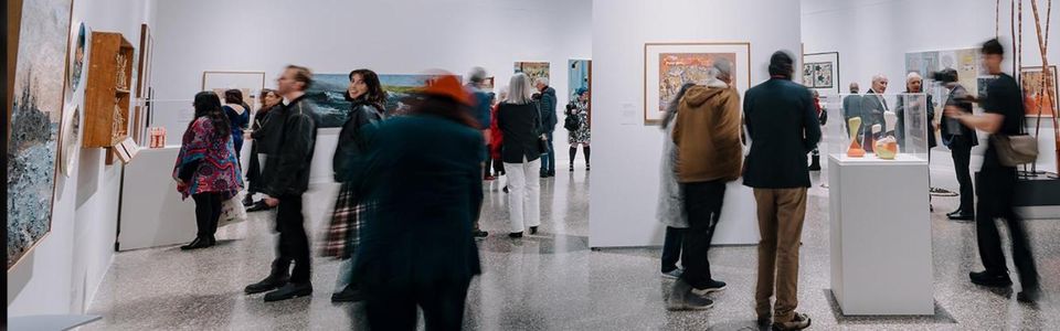 The gallery is bustling with supporters of the 50 artists 50 years exhibition