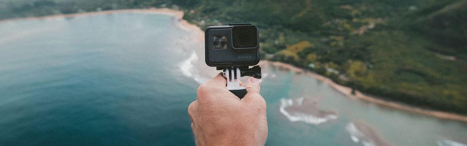 Hand holding a GoPro camera