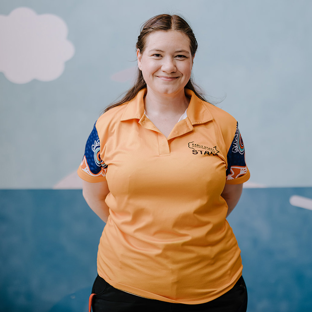 Team Member from Early Start Discovery Space smiles warmly at camera