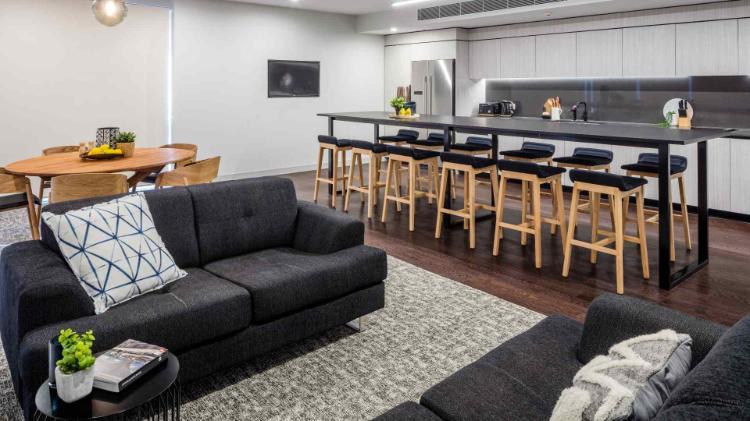 Lounge and stools in a kitchen common area