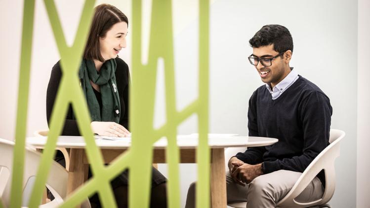 Two people talking in interview like format