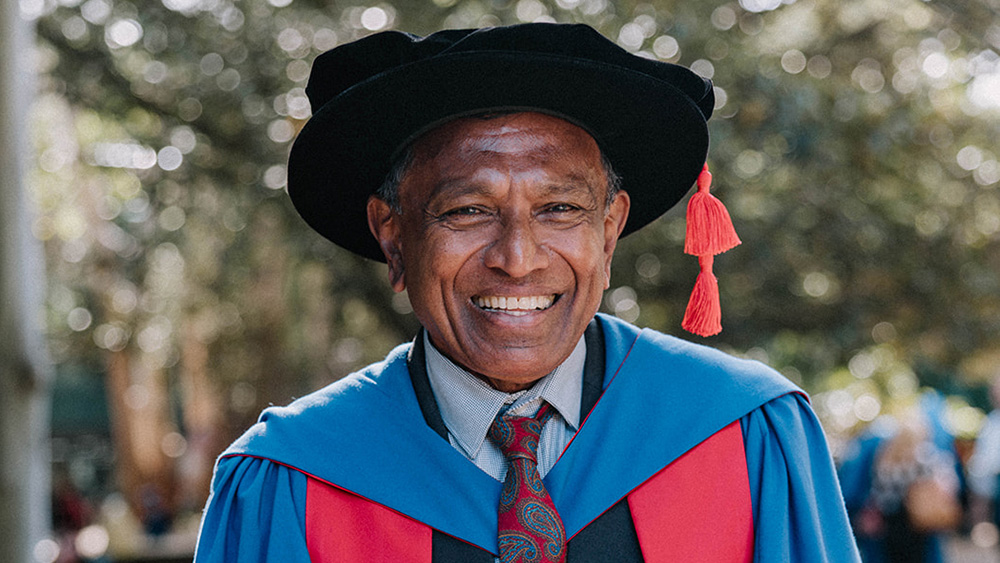Professor Sarath Perera wears a red honorary gown.