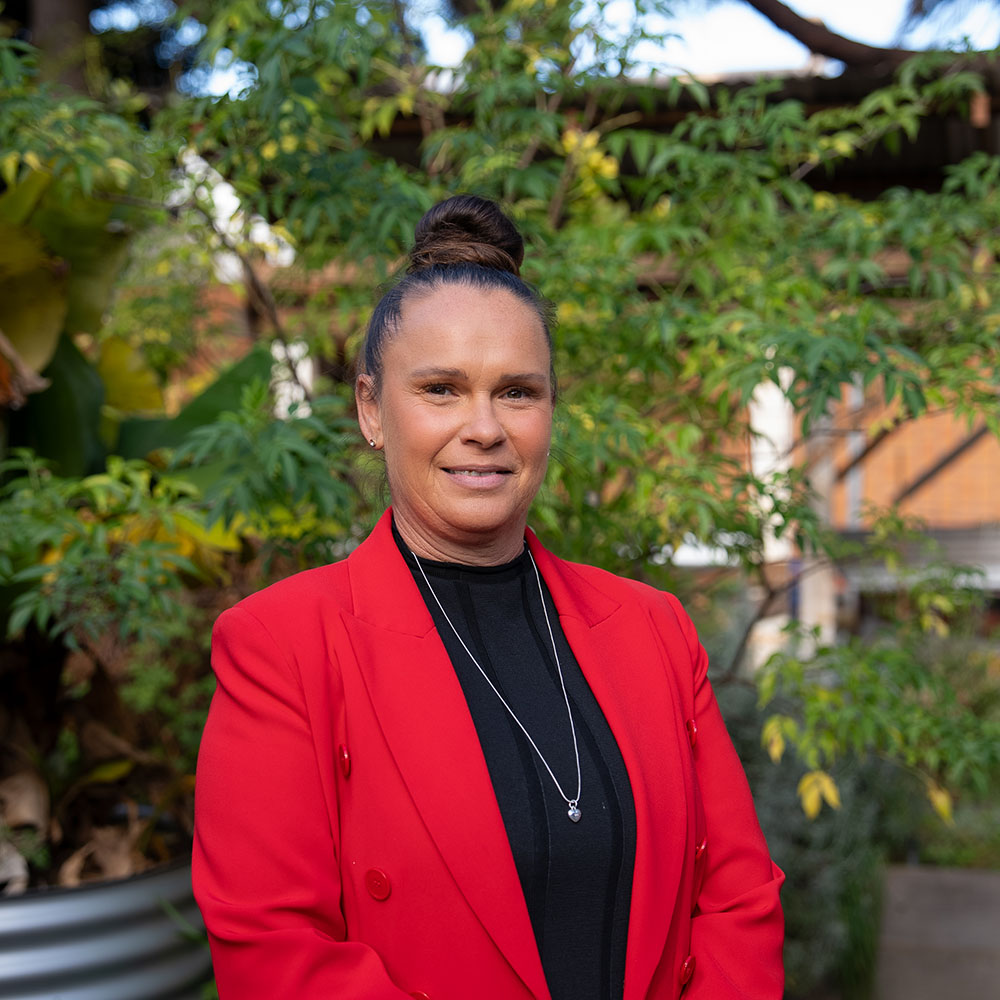 Portrait of Barbara Brennan outdoors.
