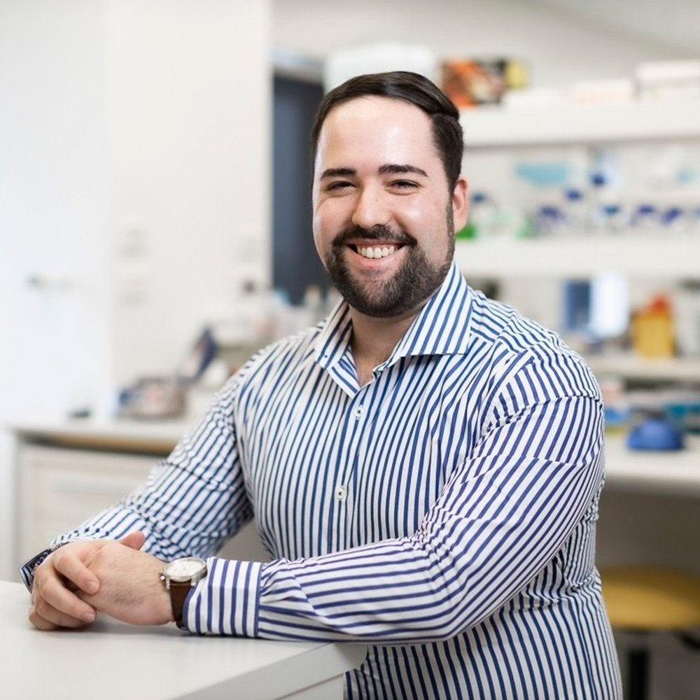 Portrait of Dr David Almeida Cardoso in a laboratory setting.