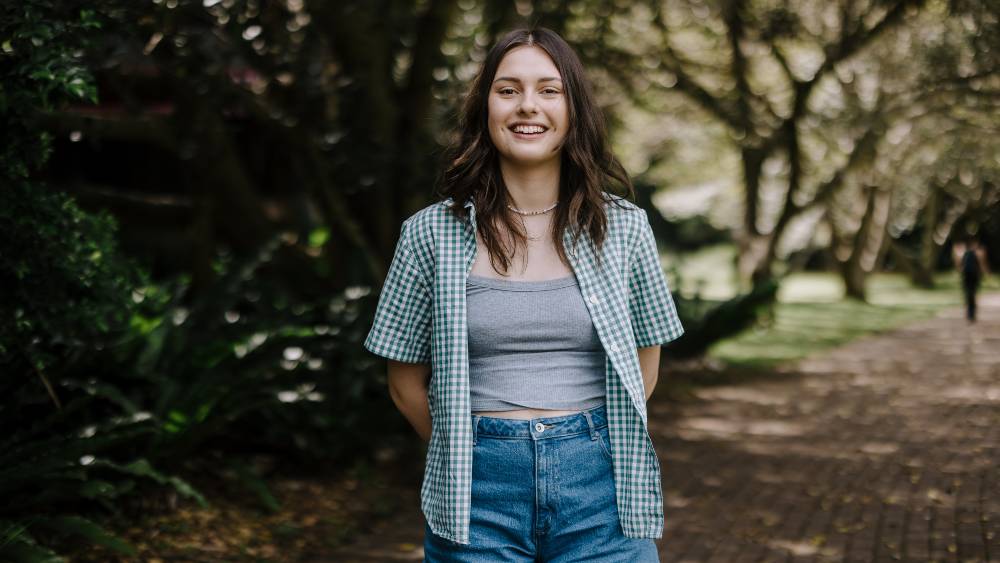 Woman smiling standing outside