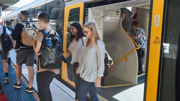 Students getting off a train