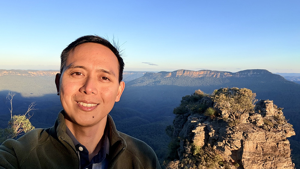 Dane De los Santos with the Blue Mountains in the background view
