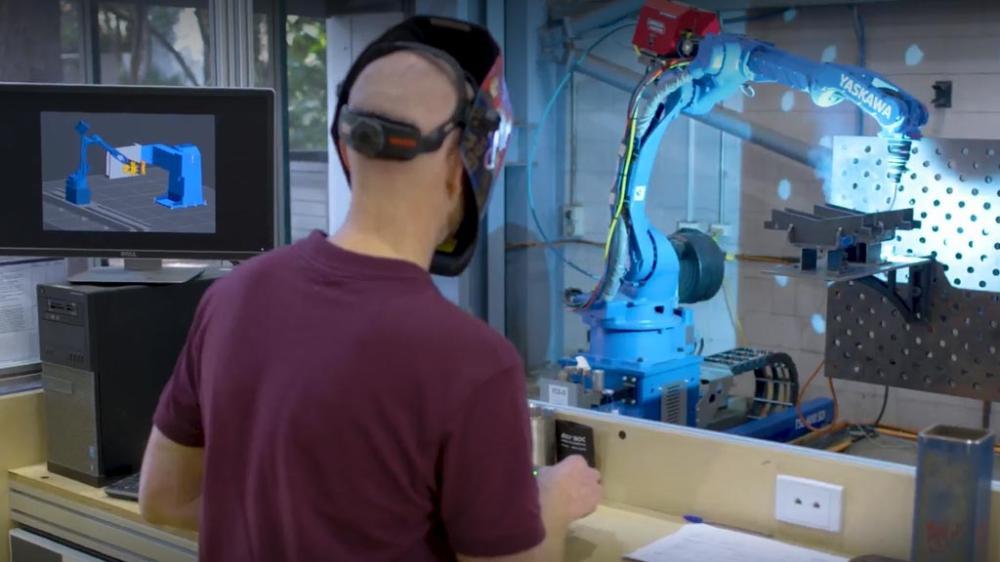 Man welding in the Facility for Intelligent Fabrication workshop