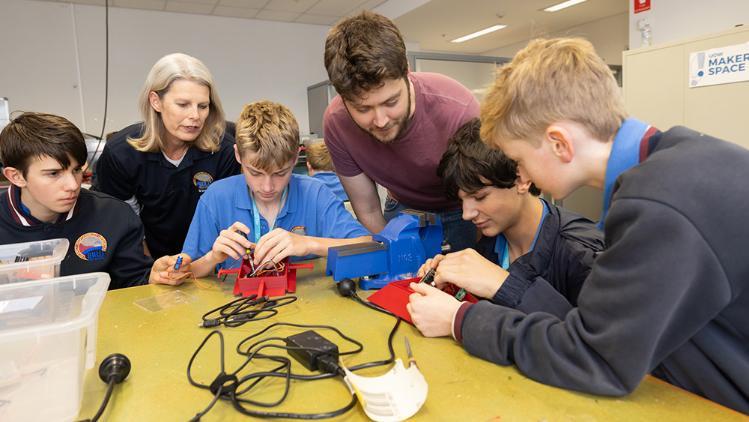 High school students working collaboratively at Makerspace