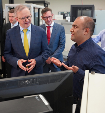 Prime Minister Albanese engaging in a discussion with Obaidur Rahman, a ýapp PhD scholar and staff member at the Australian Power Quality Research Centre (APQRC).