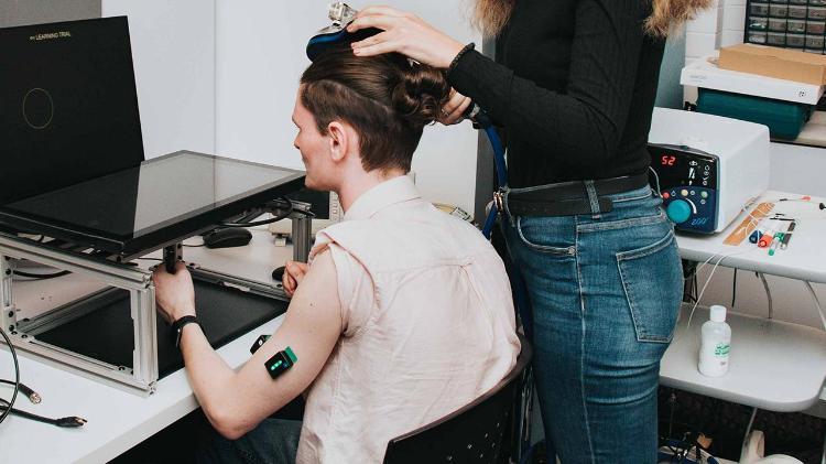 man in lab, studying visual feedback of hand movements