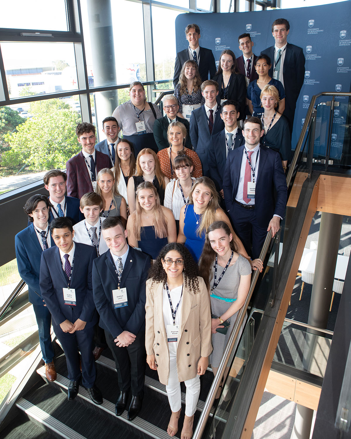 Group of students standing on stairs