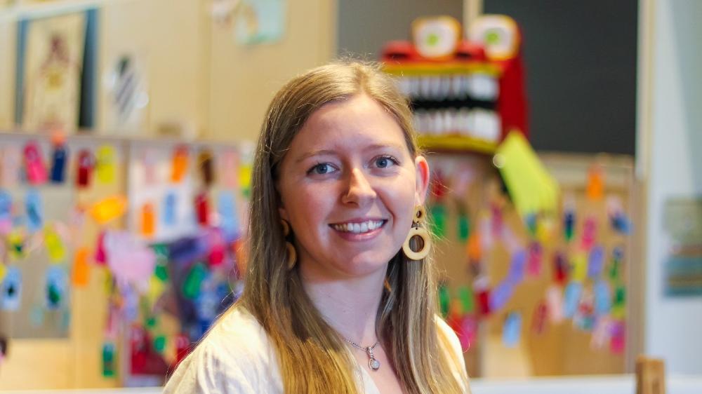Sophie Russell standing in early learning room