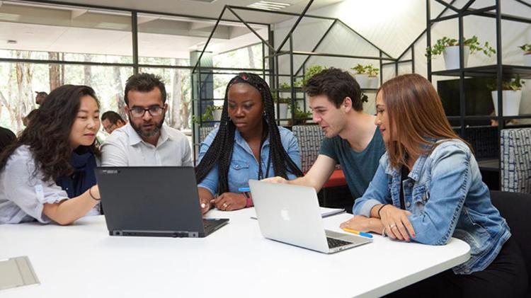 Diverse faculty members sitting in UOW library