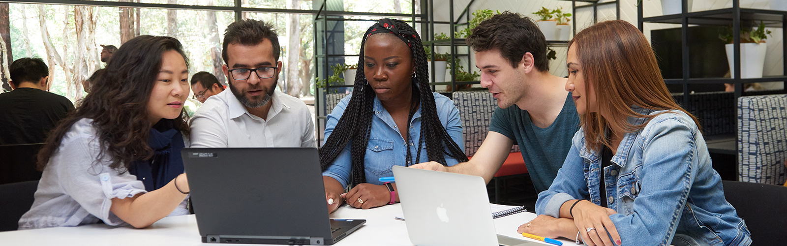 A group of diverse people having a working group in the UOW library