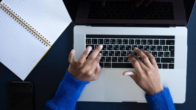 Top view of woman using laptop