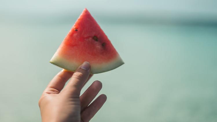 Hand holding watermelon