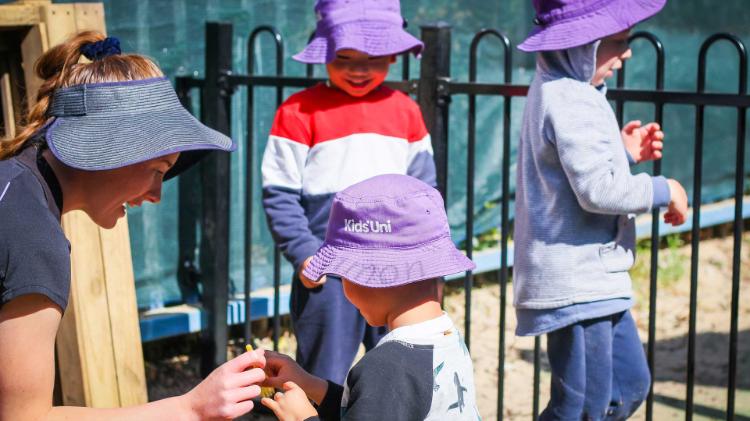 An educator from Kids Uni engaging with a child
