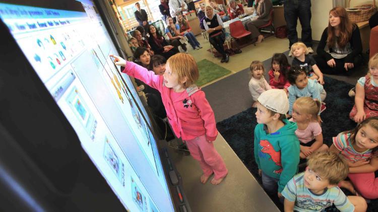 kid with smartboard