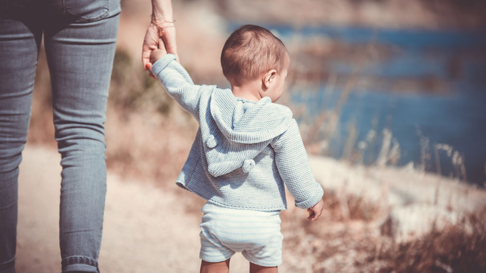 Parent and child holding hands