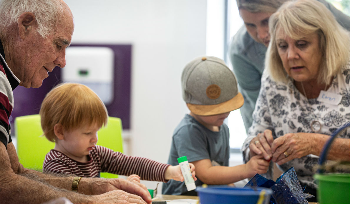 Intergenerational Playgroup. The elderly playing with children