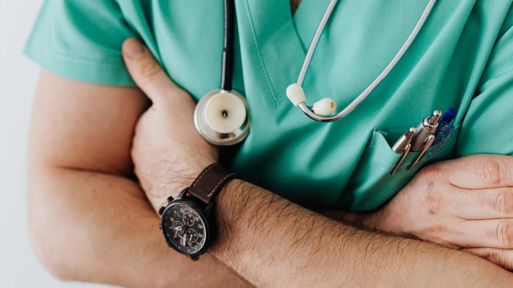 Image of Doctor in scrubs with stehoscope